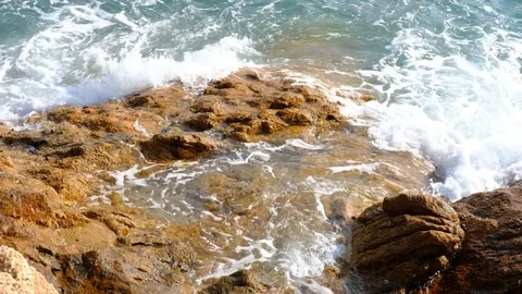 Waves on rocky beach Stock Footage 83867527