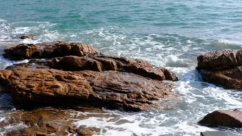 Waves on rocky beach Stock Footage 83867541