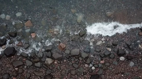 Waves on rocky beach Stock Footage 86541697