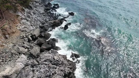 Waves on the rocky beach Видео 305821730