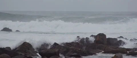 Waves in rocky beach, steady shot Stock Footage 212460907