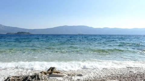 Waves on Rocky Beach With View Stock Footage 54909489