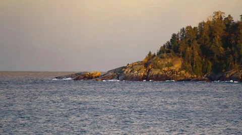 Waves on a rocky shore from afar Stock Footage 37228872
