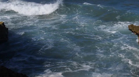 Waves on rocky shore Stock Footage 33045541