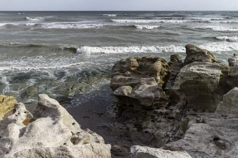 Waves on the rocky shore Stock Photos