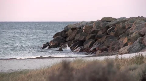 Waves on The Rocky Shore At Sunset Stock Footage 49715784