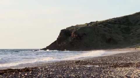 Waves on The Rocky Shore At Sunset Stock Footage 49738498