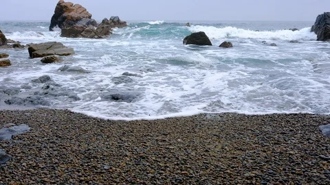 The waves on the rocky summer beach, Spain Video stock 90486034