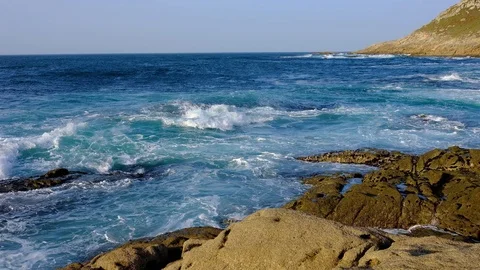 The waves on the rocky summer beach, Spain Stock Footage 90486095