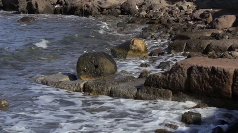 Waves roll in across ancient sunken harbor walls Stock Footage 82260863