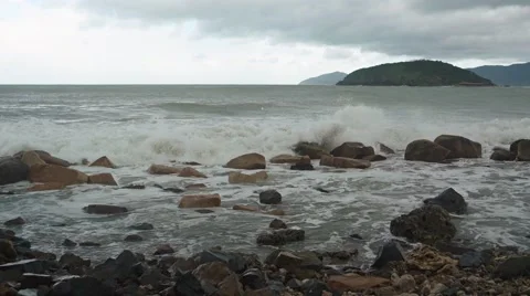 Waves Roll and Beak over a Rocky Vietnamese Beach Stock-Footage 68104484
