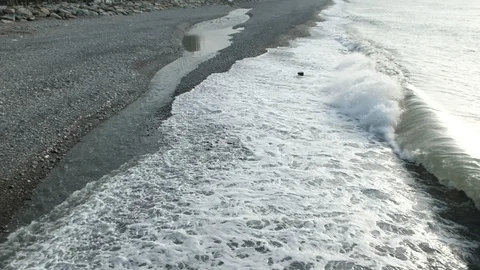 Waves roll ashore Video stock 128798241