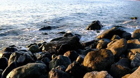 Waves roll ashore. Video stock 133756374