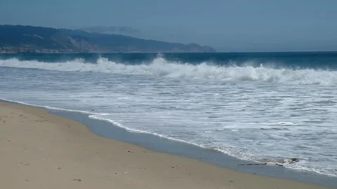 Waves roll onto beach 2 9347 스톡 동영상 93327214