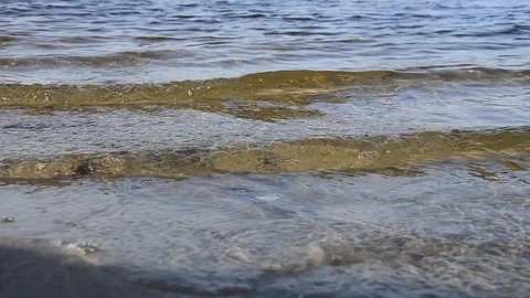 Waves roll on the beach with sand. asmr Stock Footage 124380792