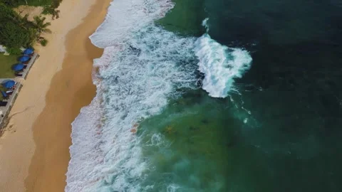 Waves roll onto the beach, srilanki, sand, spray, rocks, 4k Video stock 274150120