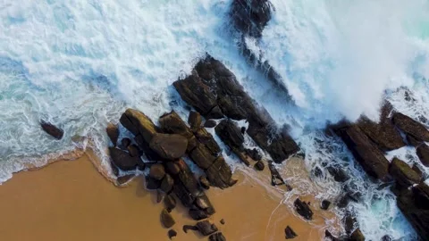 Waves roll onto the beach, srilanki, sand, spray, rocks, 4k Video stock 274150127