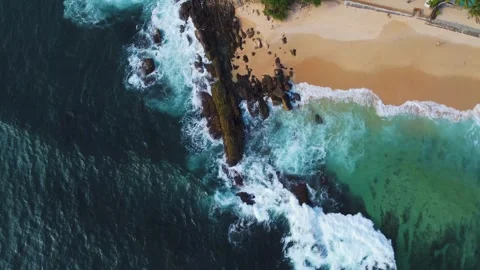 Waves roll onto the beach, srilanki, sand, spray, rocks, 4k Video stock 274150130