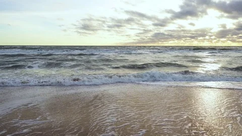 Waves roll down and run to the shore Stock Footage 82171988