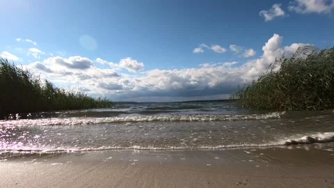 Waves roll over the sandy beach. Stock Footage 141135729