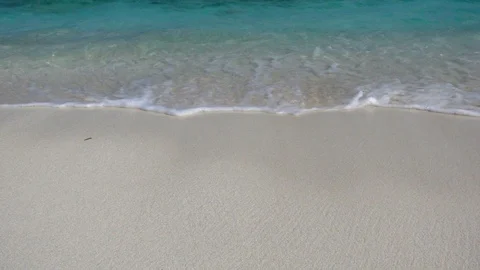 Waves roll in sandy beach. Turquoise water. Maldives. Slow motion 240 fps Stock Footage 119154176