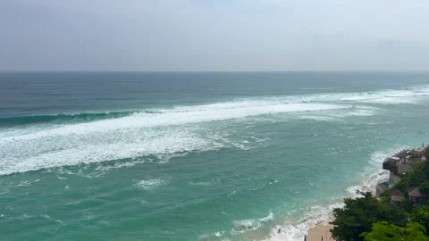 Waves roll onto sandy shores of a tropical beach Stock-Footage 337084123