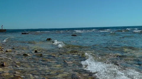 Waves roll onto the shore Stock Footage 87725636
