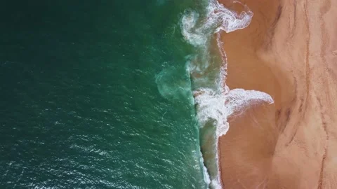 The waves roll on the shore. Yellow sandy beach with blue sea. Stock Footage 190921758