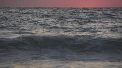 Waves Roll in as the Sun Sets Stock Footage 48687189