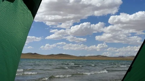 The waves rolled slowly on a coast. View from the tourist tent. Stock Footage 79776315