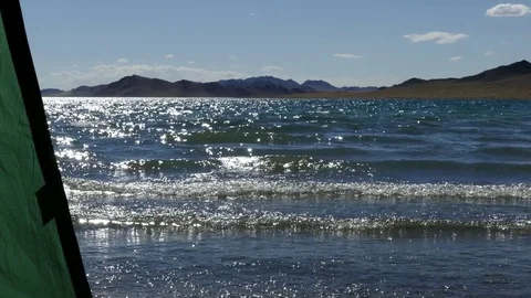 The waves rolled slowly on a coast. View from the tourist marquee. Stock Footage 79776486