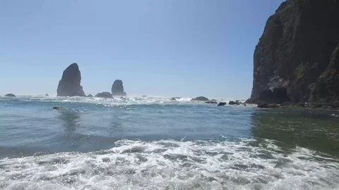 Waves rolling in against rock formation Stock Footage 92456237