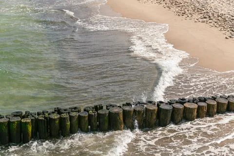Waves Rolling Along The Groin Stock Photos