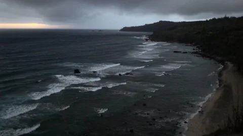 Waves rolling into a beach during sunset. Stock Footage 88342866
