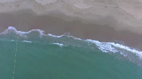 Waves rolling on the beach in Emerald Bay Stock Footage 63475623