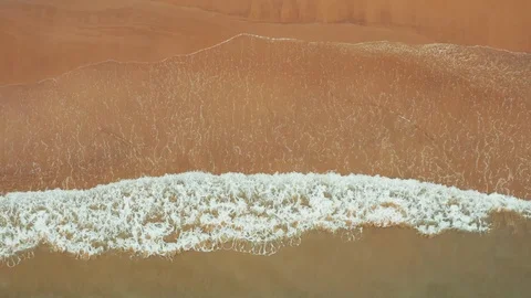 Waves rolling on to beach Stock Footage 97797823