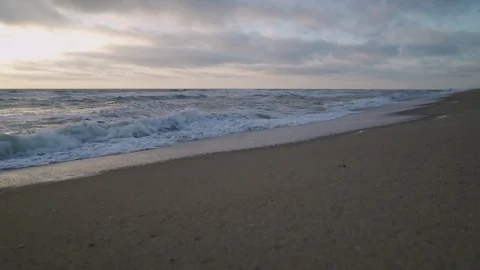Waves rolling in on a beach Stock Footage 98508891