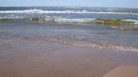 Waves rolling onto the beach at Pere Marquette Micihgan. 4k60p Stock Footage 132191934