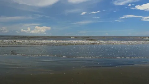 Waves rolling in on the beach - with sound Stock Footage