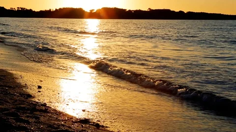 Waves Rolling in at Beach at Sunset with Tracking Camera in Sardinia 1 Stock Footage 90243003