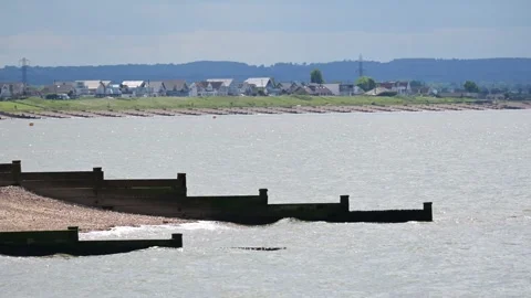 Waves rolling onto the beach in Whitstable overlooking Seasalter Stock Footage 277294136