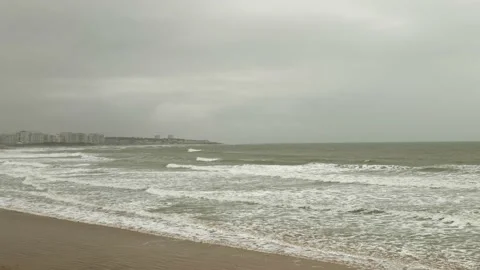 Waves rolling in on beach on windy day after storm passing by in Atlantic ocean Stock Footage 239014067
