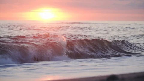 Waves rolling in at a beautiful beach in Denmark during sunset Stock Footage 119116158
