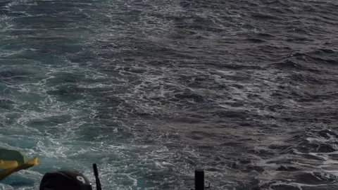 Waves rolling behind the boat as it moves through the ocean Video stock 336391862