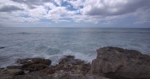 Waves Rolling in Behind Volcanic Rock in Hawaii Stock Footage 104415024