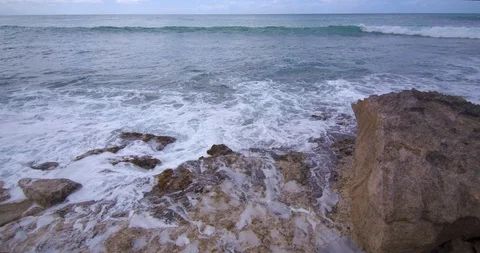Waves Rolling in Behind Volcanic Rock in Hawaii Stock Footage 104418388