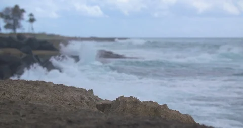 Waves Rolling in Behind Volcanic Rock on the West Shore of Oahu in Slow Motion Stock Footage 104419953