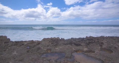 Waves Rolling in Behind Volcanic Rock in Hawaii Stock Footage 104420057