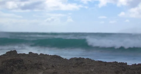 Waves Rolling in Behind Volcanic Rock in Hawaii Stock Footage 104424444