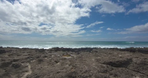 Waves Rolling in Behind Volcanic Rock in Hawaii Stock Footage 104428848